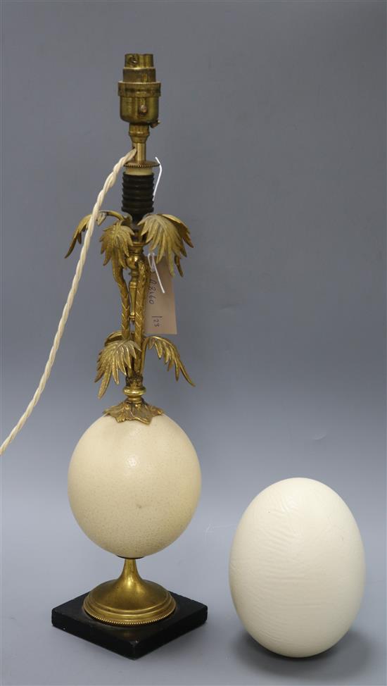 An ormolu and ostrich egg lamp and another egg shell overall height 52cm